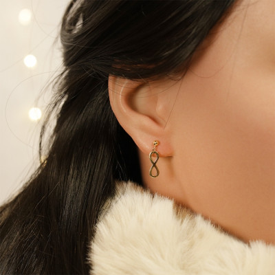 BOUCLES D'OREILLES TIGE PLAQUÉ OR 1 INFINI ET 1 CROIX OXYDES BLANCS SERTIS 